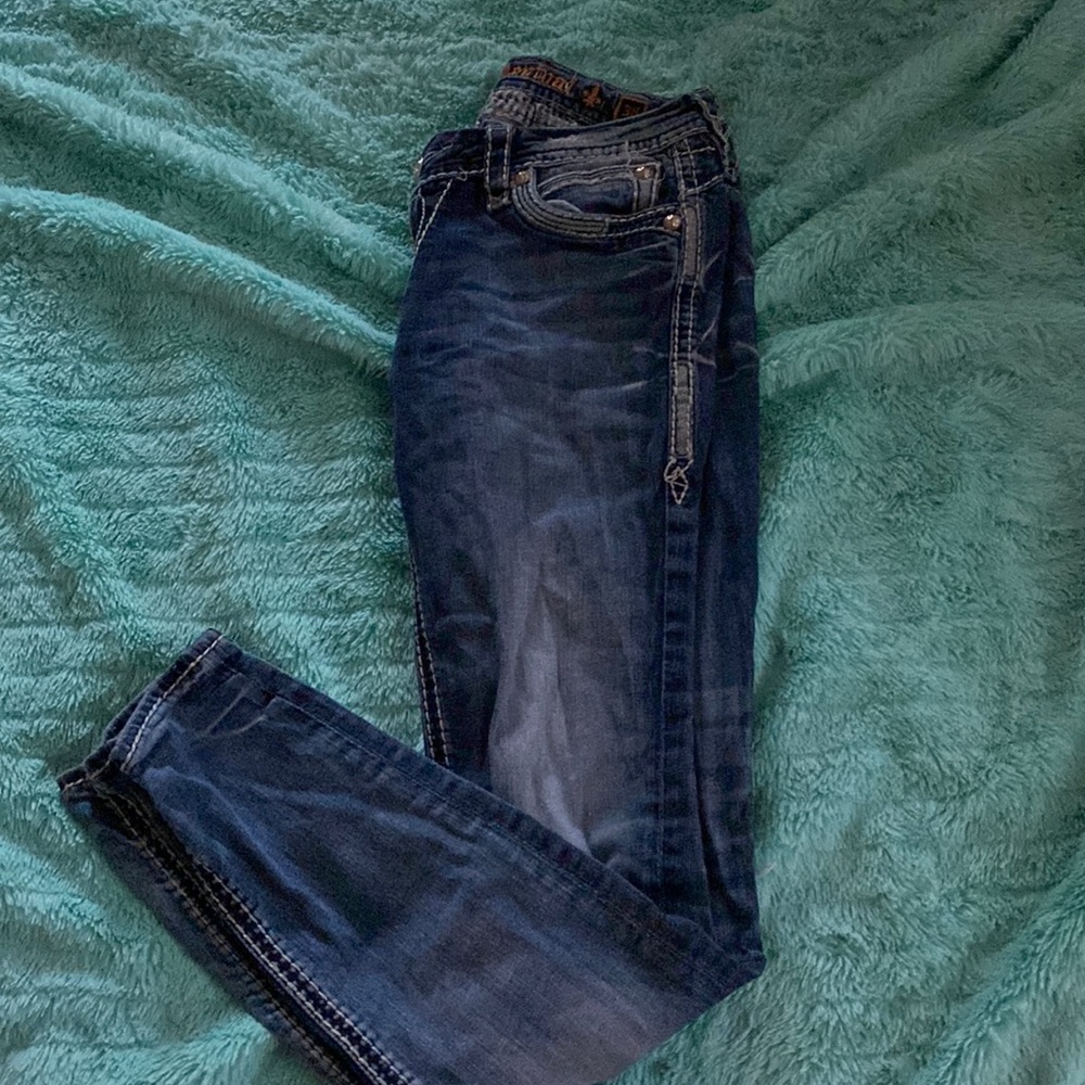 Rock revival jeans with a hole in the knee